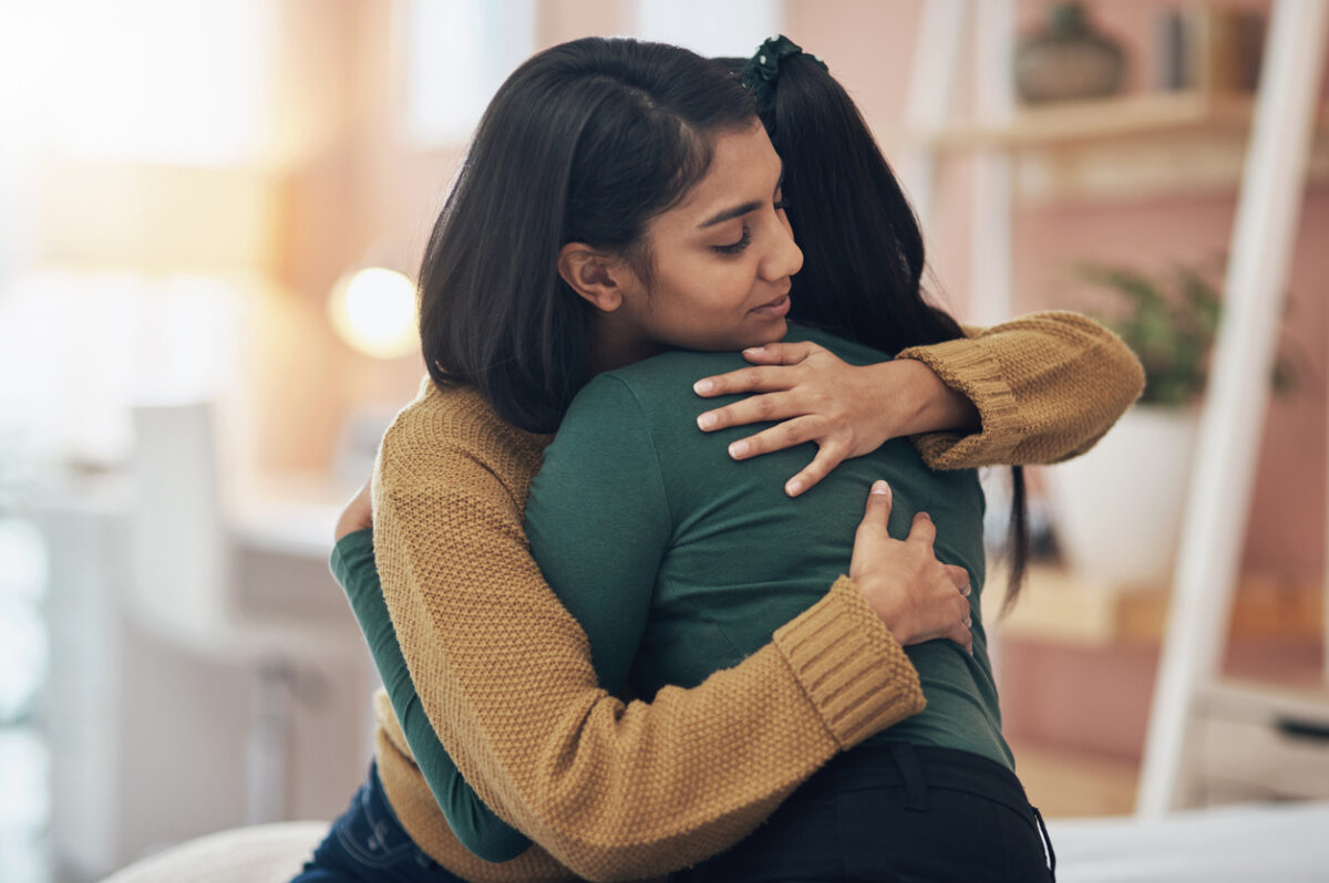 Cropped shot of two young women embracing each other